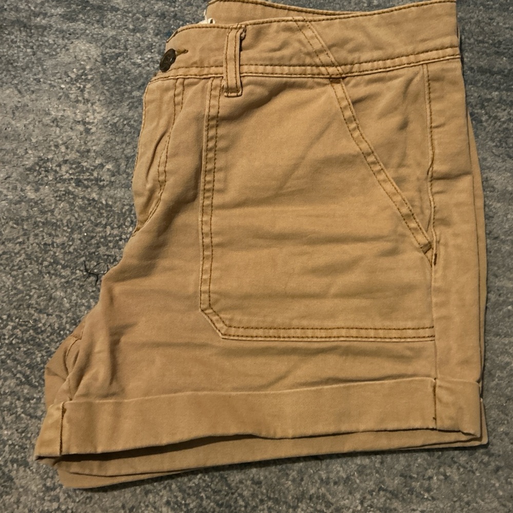 Khaki/tan shorts.